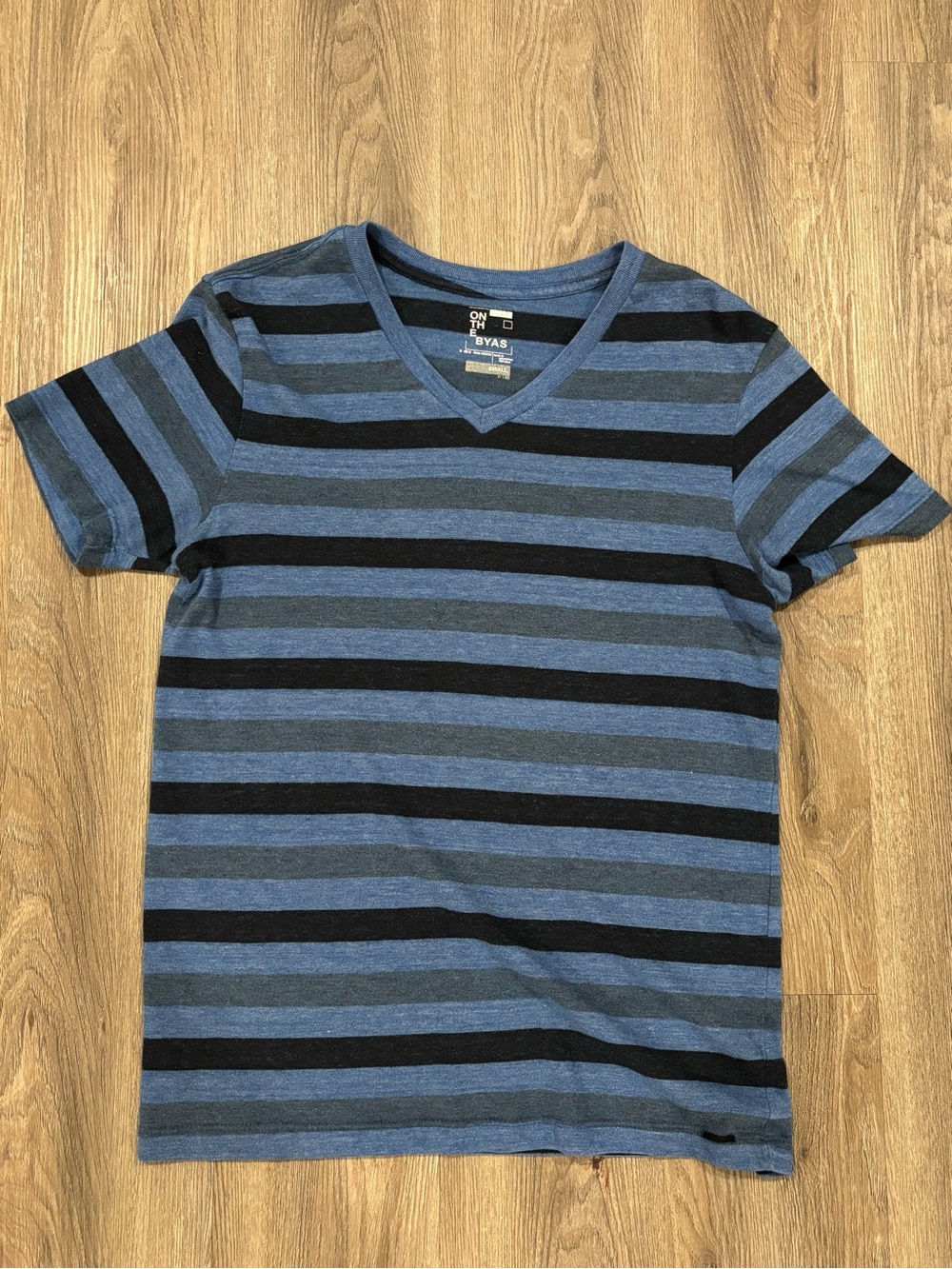on the byas Blue and Black Striped V-Neck Tee Shirt